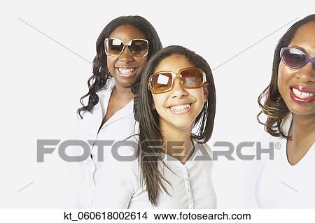 Studio shot of African mother and daughters smiling View Large Photo Image Picture - Studio shot of African mother and daughters smiling. Fotosearch