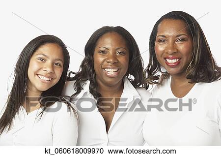 Studio shot of African mother and daughters smiling View Large Photo Image Stock Image - Studio shot of African mother and daughters smiling. Fotosearch