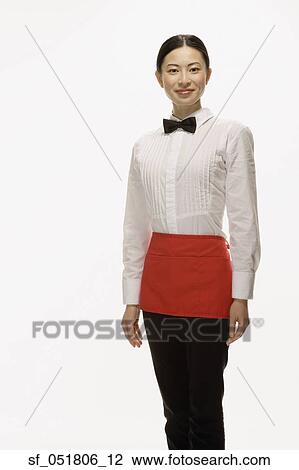 Studio shot of Asian waitress smiling View Large Photo Image Stock Image - Studio shot of Asian waitress smiling. Fotosearch