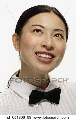 Stock Photo - Studio shot of Asian woman smiling. Fotosearch