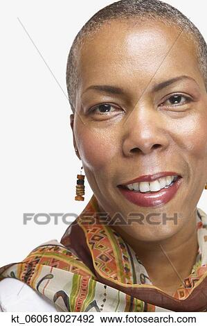 Studio shot of middle-aged African woman smiling View Large Photo Image Stock Image - Studio shot of middle-aged African woman smiling. Fotosearch