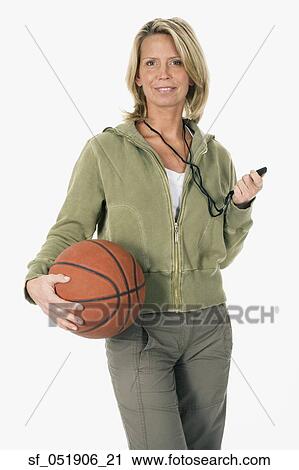 Studio shot of woman with whistle and basketball View Large Photo Image Stock Image - Studio shot of woman with whistle and basketball. Fotosearch