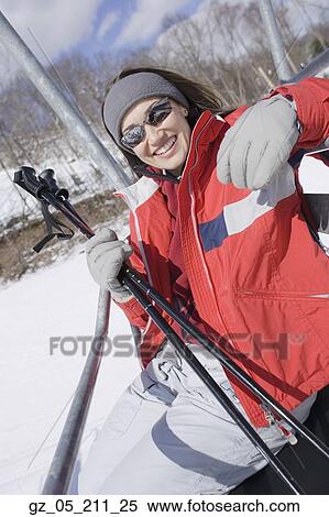 Woman smiling on ski lift View Large Photo Image Stock Photography - Woman smiling on ski lift. Fotosearch