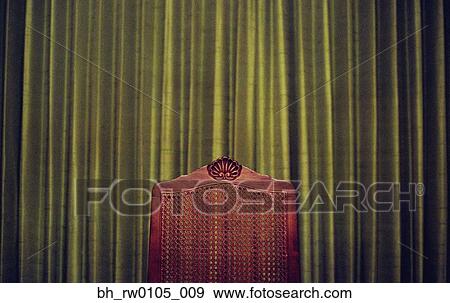 Wooden chair in front of curtains View Large Photo Image Stock Photo - Wooden chair in front of curtains. Fotosearch