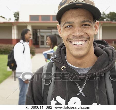 Young African man smiling on school campus View Large Photo Image Stock Image - Young African man smiling on school campus. Fotosearch