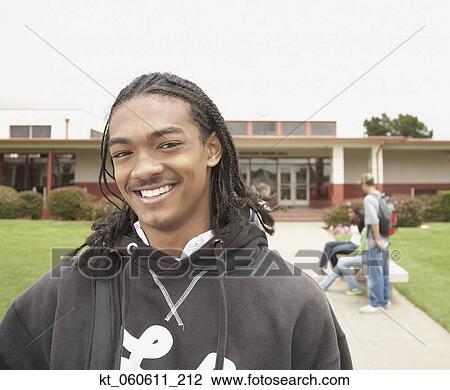 Young African man smiling on school campus View Large Photo Image Stock Image - Young African man smiling on school campus. Fotosearch