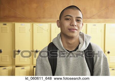 Young Asian man next to school lockers View Large Photo Image Stock Photo - Young Asian man next to school lockers. Fotosearch