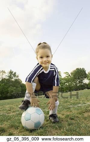 Young girl in athletic gear with soccer ball View Large Photo Image Stock Photo - Young girl in athletic gear with soccer ball . Fotosearch