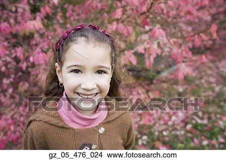 Young girl smiling outdoors View Large Photo Image Picture - Young girl smiling outdoors. Fotosearch