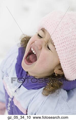 Young girl yelling in snowsuit outdoors View Large Photo Image Stock Image - Young girl yelling in snowsuit outdoors. Fotosearch