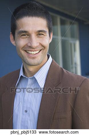 Close up of Hispanic businessman smiling View Large Photo Image Stock Image - Close up of Hispanic businessman smiling . Fotosearch