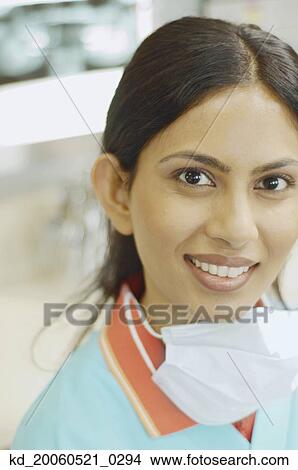 Close up of Indian female dental assistant smiling View Large Photo Image Picture - Close up of Indian female dental assistant smiling. Fotosearch