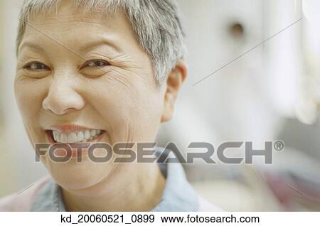 Close up of senior Asian woman smiling View Large Photo Image Stock Photo - Close up of senior Asian woman smiling. Fotosearch