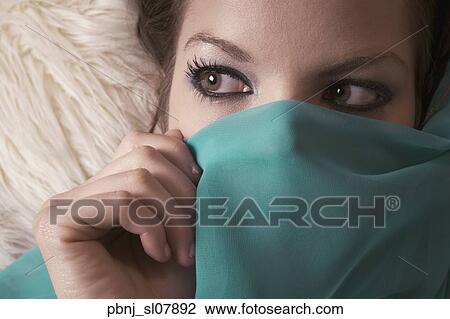 Close up of woman holding veil over lower half of face View Large Photo Image Stock Image - Close up of woman holding veil over lower half of face. Fotosearch