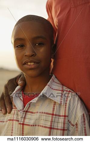Close up of young African boy View Large Photo Image Stock Photograph - Close up of young African boy. Fotosearch