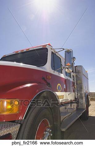 Fire truck in sunlight View Large Photo Image Stock Photograph - Fire truck in sunlight. Fotosearch