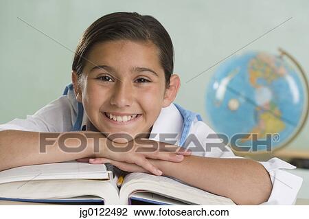 Hispanic girl leaning on textbooks and smiling View Large Photo Image Stock Image - Hispanic girl leaning on textbooks and smiling. Fotosearch