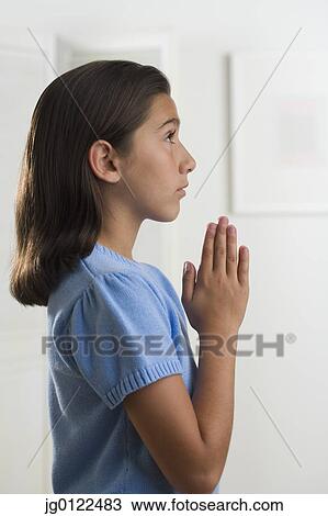 Hispanic girl praying indoors View Large Photo Image Stock Image - Hispanic girl praying indoors. Fotosearch