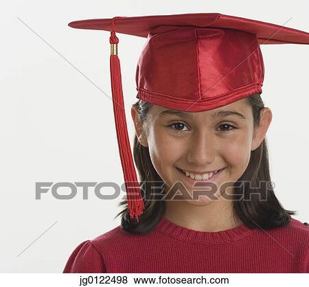 Stock Photo - Hispanic girl wearing graduation cap. Fotosearch