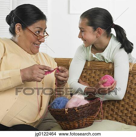 Hispanic grandmother and granddaughter with knitting supplies View Large Photo Image Picture - Hispanic grandmother and granddaughter with knitting supplies. Fotosearch