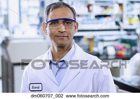 Stock Image - Indian male scientist with protective eyewear. Fotosearch
