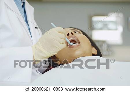 Senior Asian female dentist in office View Large Photo Image Stock Image - Senior Asian female dentist in office. Fotosearch