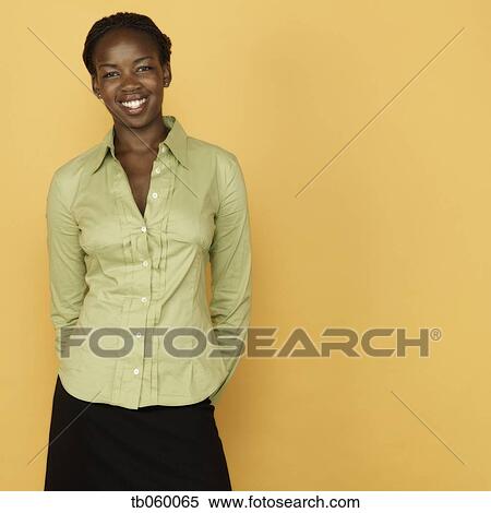 Studio shot of African woman smiling View Large Photo Image Stock Photography - Studio shot of African woman smiling. Fotosearch