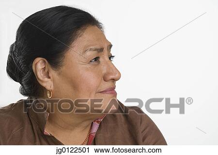 Studio shot of senior Hispanic woman looking to side View Large Photo Image Stock Image - Studio shot of senior Hispanic woman looking to side. Fotosearch