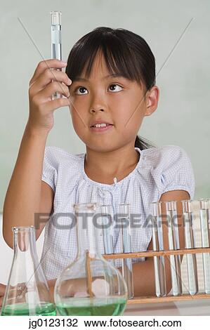 Young Asian girl with science equipment View Large Photo Image Stock Image - Young Asian girl with science equipment. Fotosearch