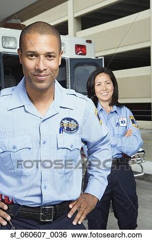 African male paramedic smiling in front of ambulance View Large Photo Image Stock Photograph - African male paramedic smiling in front of ambulance. Fotosearch