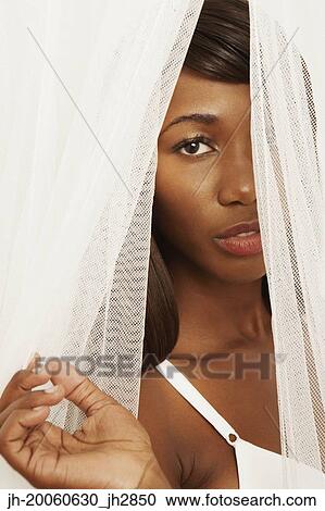 African woman in bra standing in curtains View Large Photo Image Stock Image - African woman in bra standing in curtains. Fotosearch