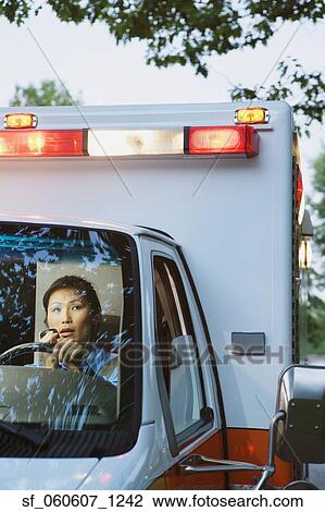 Asian female paramedic driving ambulance View Large Photo Image Stock Image - Asian female paramedic driving ambulance. Fotosearch