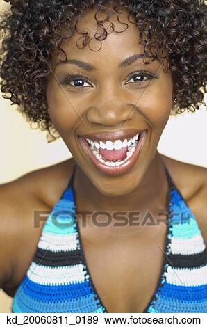 Stock Photo - Close up of African woman laughing. Fotosearch