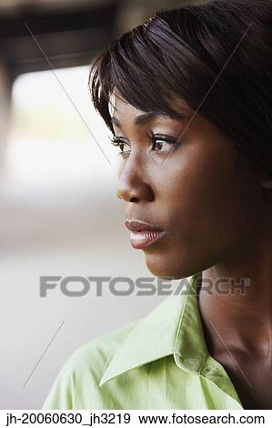 Stock Photo - Close up of African woman outdoors. Fotosearch
