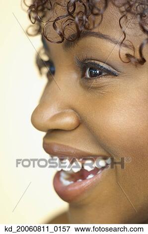 Close up of African woman smiling View Large Photo Image Stock Photo - Close up of African woman smiling. Fotosearch