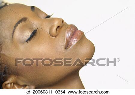Close up of African woman with eyes closed View Large Photo Image Picture - Close up of African woman with eyes closed. Fotosearch
