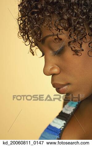 Close up of African woman with eyes closed View Large Photo Image Stock Photo - Close up of African woman with eyes closed. Fotosearch