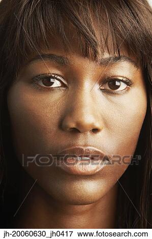 Stock Photo - Close up of African woman's face. Fotosearch