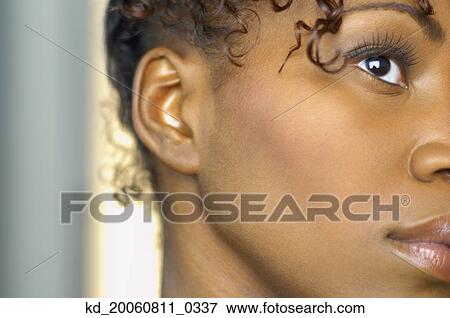 Stock Photo - Close up of African woman's face. Fotosearch