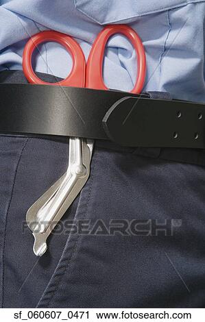 Close up of surgical scissors in person's belt View Large Photo Image Stock Image - Close up of surgical scissors in person's belt. Fotosearch