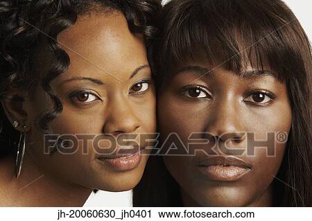 Close up of two African women with faces touching View Large Photo Image Stock Image - Close up of two African women with faces touching. Fotosearch