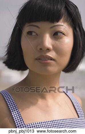 Close up of young Asian woman at beach View Large Photo Image Stock Image - Close up of young Asian woman at beach. Fotosearch