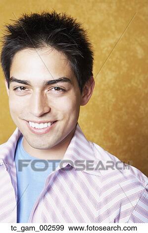 Close up of young man smiling indoors View Large Photo Image Stock Photo - Close up of young man smiling indoors. Fotosearch