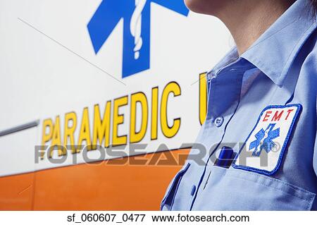 Stock Photo - Close up paramedic next to ambulance. Fotosearch