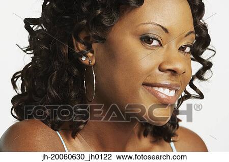 Close up studio shot of African woman smiling View Large Photo Image Stock Image - Close up studio shot of African woman smiling. Fotosearch