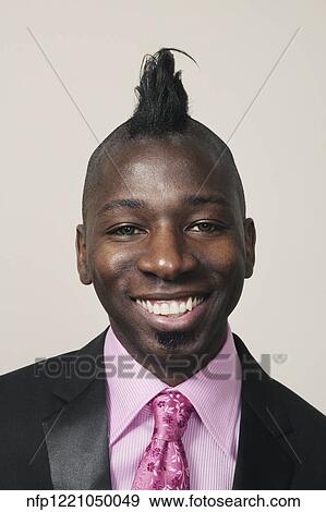 Stock Photo - African businessman with mohawk hairstyle. Fotosearch