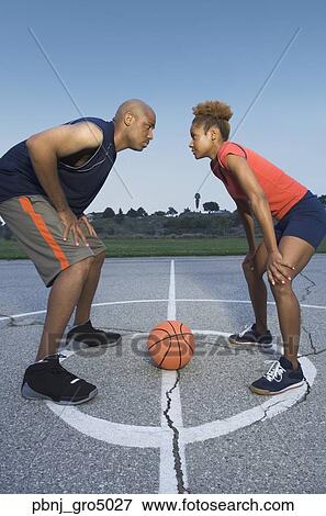 African man and woman on basketball court View Large Photo Image Stock Photo - African man and woman on basketball court. Fotosearch