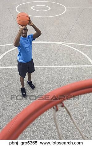 African man shooting basketball View Large Photo Image Stock Photography - African man shooting basketball. Fotosearch