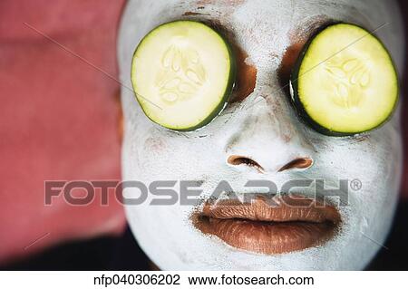 African man with facial mask and cucumber slices on eyes View Large Photo Image Stock Image - African man with facial mask and cucumber slices on eyes. Fotosearch