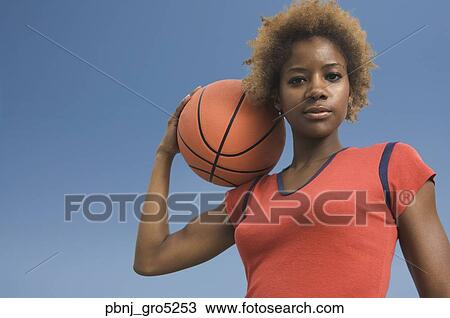 African woman holding basketball View Large Photo Image Stock Image - African woman holding basketball. Fotosearch